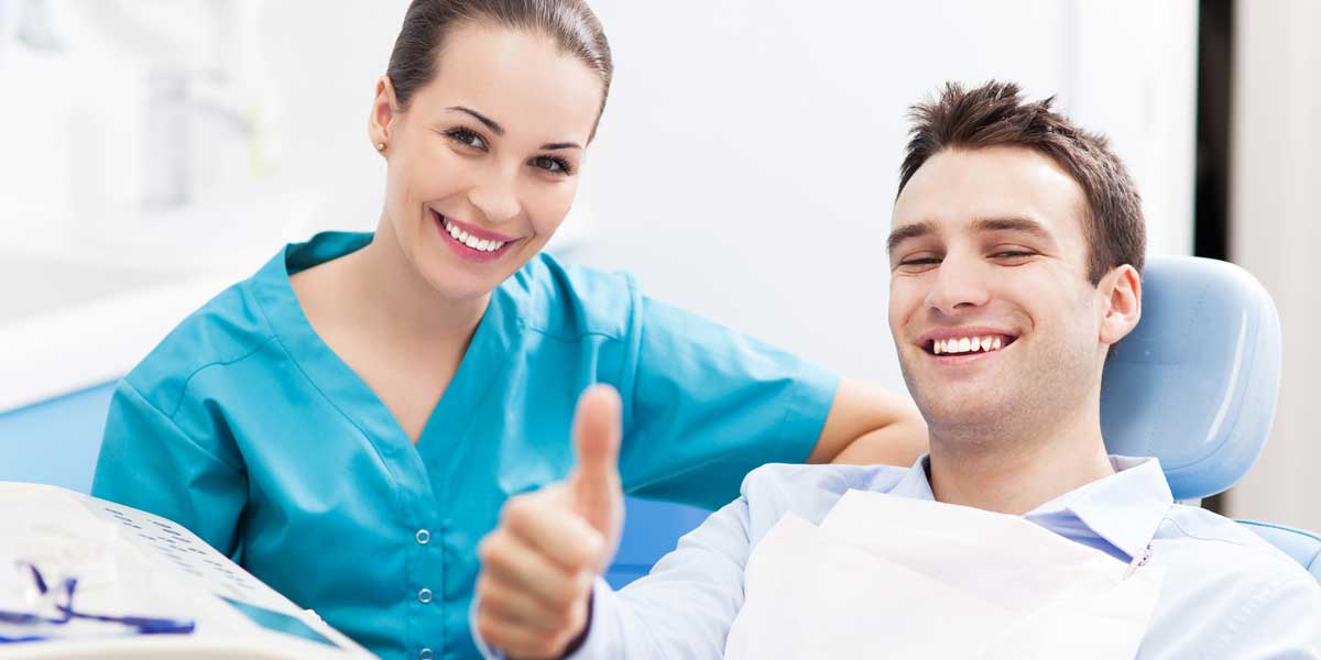 Happy Doctor and Happy Patient in Clinic